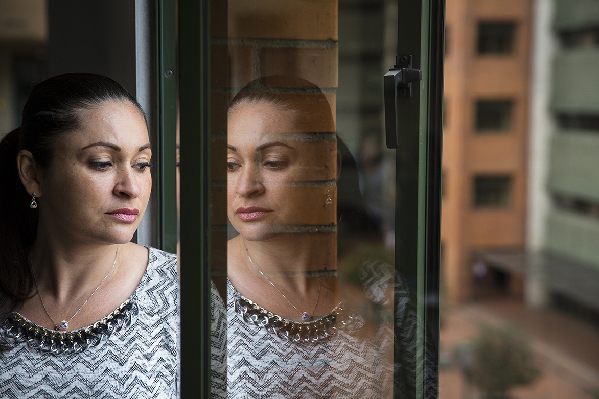 Members of Elenith's family have a mutation that causes early-onset Alzheimer's disease, but she doesn't know whether she will develop the disease. "It has haunted me all of my life but I want to be prepared if possible," she says. Image Greg Kendall-Ball. Colombia, 2018. Members of Elenith's family have a mutation that causes early-onset Alzheimer's disease, but she doesn't know whether she will develop the disease. "It has haunted me all of my life but I want to be prepared if possible," she says. Image Greg Kendall-Ball. Colombia, 2018.