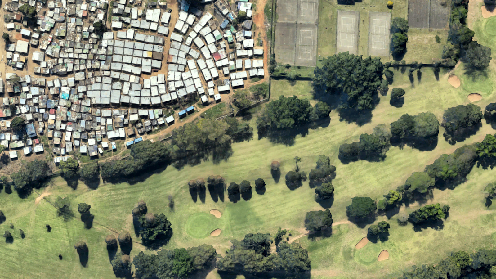 The sharp contrast in land use between the Papwa Sewgolum Golf Course and a slum in Durban, South Africa is exposed using Google Maps. Media file: papwa_sewgolum_golf_course.jpg