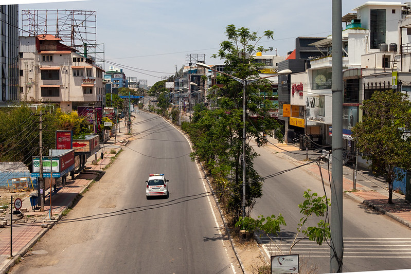 The coronavirus curfew in Bangalore: police and food delivery services are the only traffic as the country's IT hub moved to working remotely. Image by Nicolas Mirguet / Flickr. India, 2020. The coronavirus curfew in Bangalore: police and food delivery services are the only traffic as the country's IT hub moved to working remotely. Image by Nicolas Mirguet / Flickr. India, 2020.