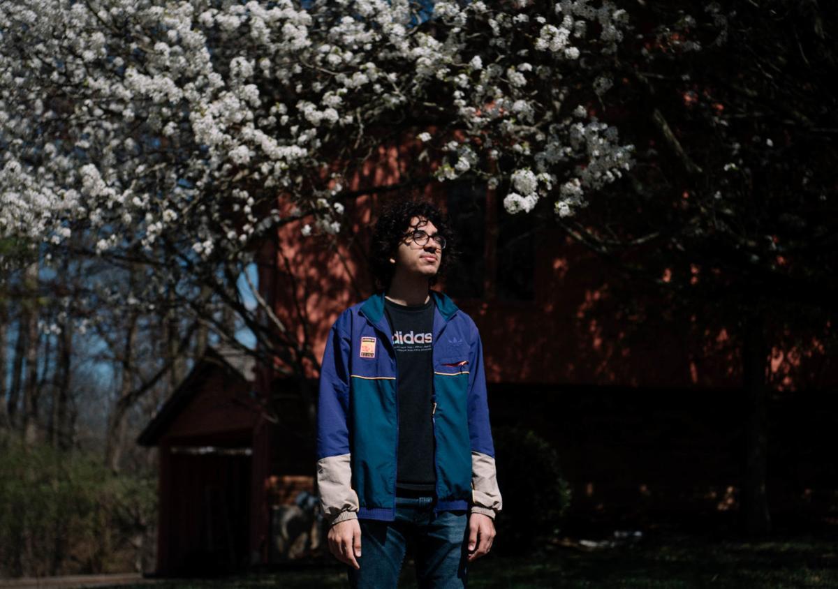 Adam Lahlou, senior class president at Carbondale Community High School, stands for a portrait outside his home in Carbondale. Lahlou, like many seniors across the country, is living in uncertainty for the future of senior year while COVID-19 cases increase daily across the United States. Image by Brian Munoz. United States, 2020. Adam Lahlou, senior class president at Carbondale Community High School, stands for a portrait outside his home in Carbondale. Lahlou, like many seniors across the country, is living in uncertainty for the future of senior year while COVID-19 cases increase daily across the United States. Image by Brian Munoz. United States, 2020.