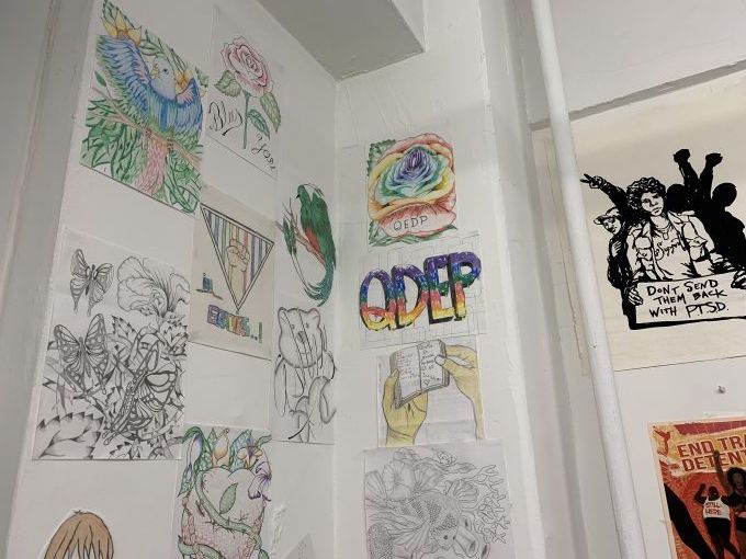 Drawings featured on one of the walls of the Queer Detainee Empowerment Project’s office. Several were created by detainees and sent to the organization from detention centers. Image by Adithi Ramakrishnan. United States, 2020. Drawings featured on one of the walls of the Queer Detainee Empowerment Project’s office. Several were created by detainees and sent to the organization from detention centers. Image by Adithi Ramakrishnan. United States, 2020.
