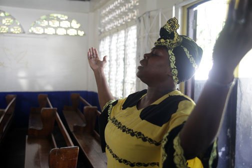 Carol finds inspiration at her church, the Mount Carmel Baptist Church. Image by Andre Lambertson. Jamaica, 2014. Media file: carol_at_joy_in_her_church.jpg