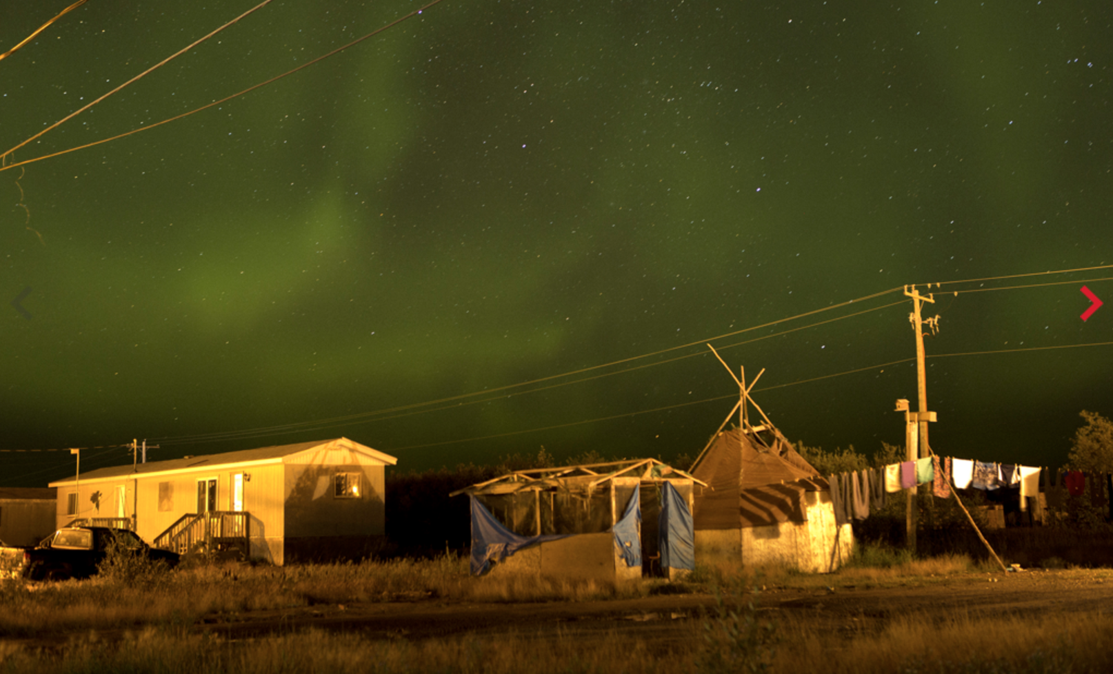 The northern lights fill the sky over the remote First Nations community of Attawapiskat. Attawapiskat is an isolated First Nation community located in northern Ontario, Canada, at the mouth of the Attawapiskat River on James Bay. On April 9, 2016, the community of approximately 2000 people declared a state of emergency after being overwhelmed with attempted suicides, over 100 attempts in a ten month period. Image by David Maurice Smith/Oculi. Canada, 2016. The northern lights fill the sky over the remote First Nations community of Attawapiskat. Attawapiskat is an isolated First Nation community located in northern Ontario, Canada, at the mouth of the Attawapiskat River on James Bay. On April 9, 2016, the community of approximately 2000 people declared a state of emergency after being overwhelmed with attempted suicides, over 100 attempts in a ten month period. Image by David Maurice Smith/Oculi. Canada, 2016.