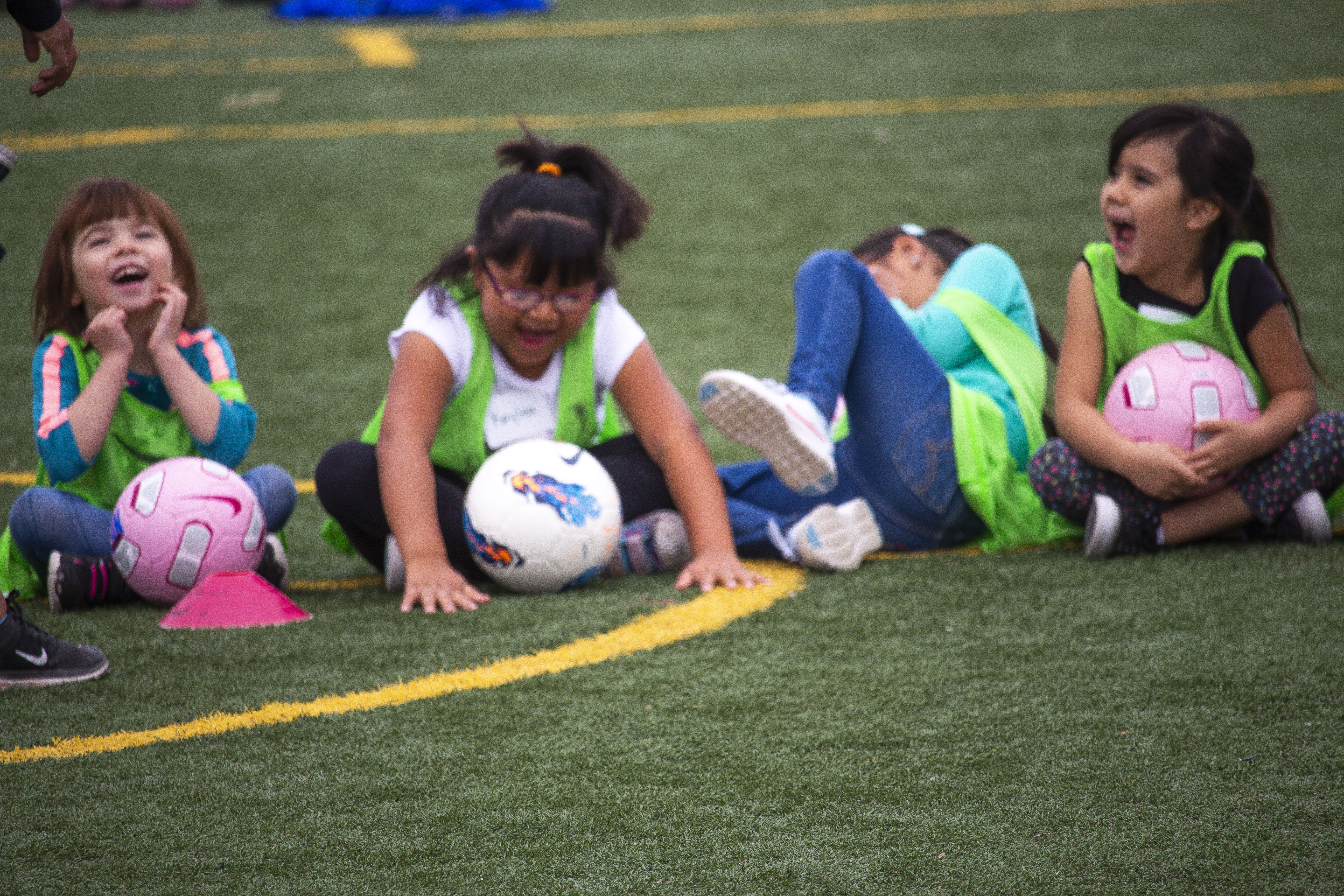 Students prepared for a scrimmage during the soccer clinic at Carroll Elementary School in Bernalillo, New Mexico. They laughed as their classmates were counted off into groups by fruit names like banana, strawberry, and apple. Image by Viridiana Vidales Coyt. United States, 2017. Students prepared for a scrimmage during the soccer clinic at Carroll Elementary School in Bernalillo, New Mexico. They laughed as their classmates were counted off into groups by fruit names like banana, strawberry, and apple. Image by Viridiana Vidales Coyt. United States, 2017.