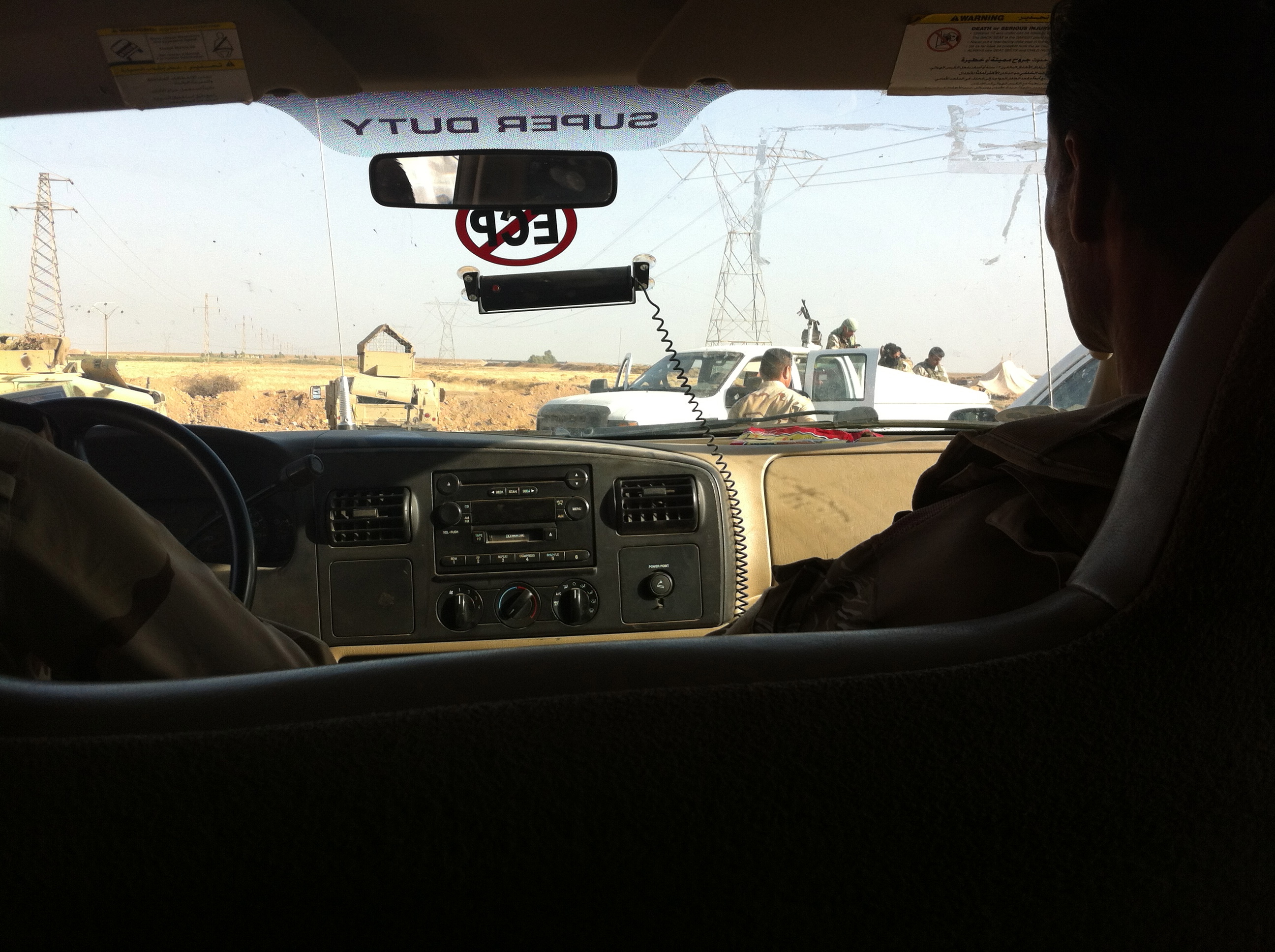 Peshmerga fighters on their way to the front line near Kirkuk in late June, 2014. Image by Jenna Krajeski. Kurdistan, 2014. Media file: img_1984.jpg