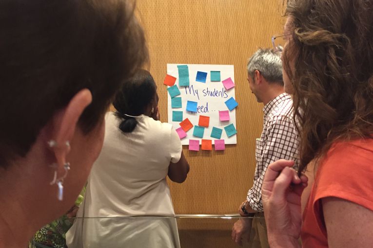 Educators at the Summer Teacher Institute in Chicago discuss what their students need while reviewing post-it notes on the topic prompt provided by Fareed Mostoufi, Pulitzer Center senior education manager. The University of Chicago and Pulitzer Center co-organized the two-day institute. Image by Evey Wilson. United States, 2016. Media file: img_7444.jpg