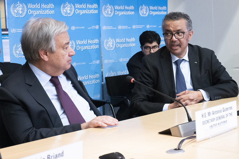 UN Secretary-General António Guterres with Tedros Adhanom Ghebreyesus Director-General of World Health Organization (WHO) during strategic briefing on COVID-19 at Strategic Health Operations Centre (SHOC) at the WHO headquarters in Geneva in February. Image UN Photo / Jean Marc Ferré. Switzerland, 2020. UN Secretary-General António Guterres with Tedros Adhanom Ghebreyesus Director-General of World Health Organization (WHO) during strategic briefing on COVID-19 at Strategic Health Operations Centre (SHOC) at the WHO headquarters in Geneva in February. Image UN Photo / Jean Marc Ferré. Switzerland, 2020.