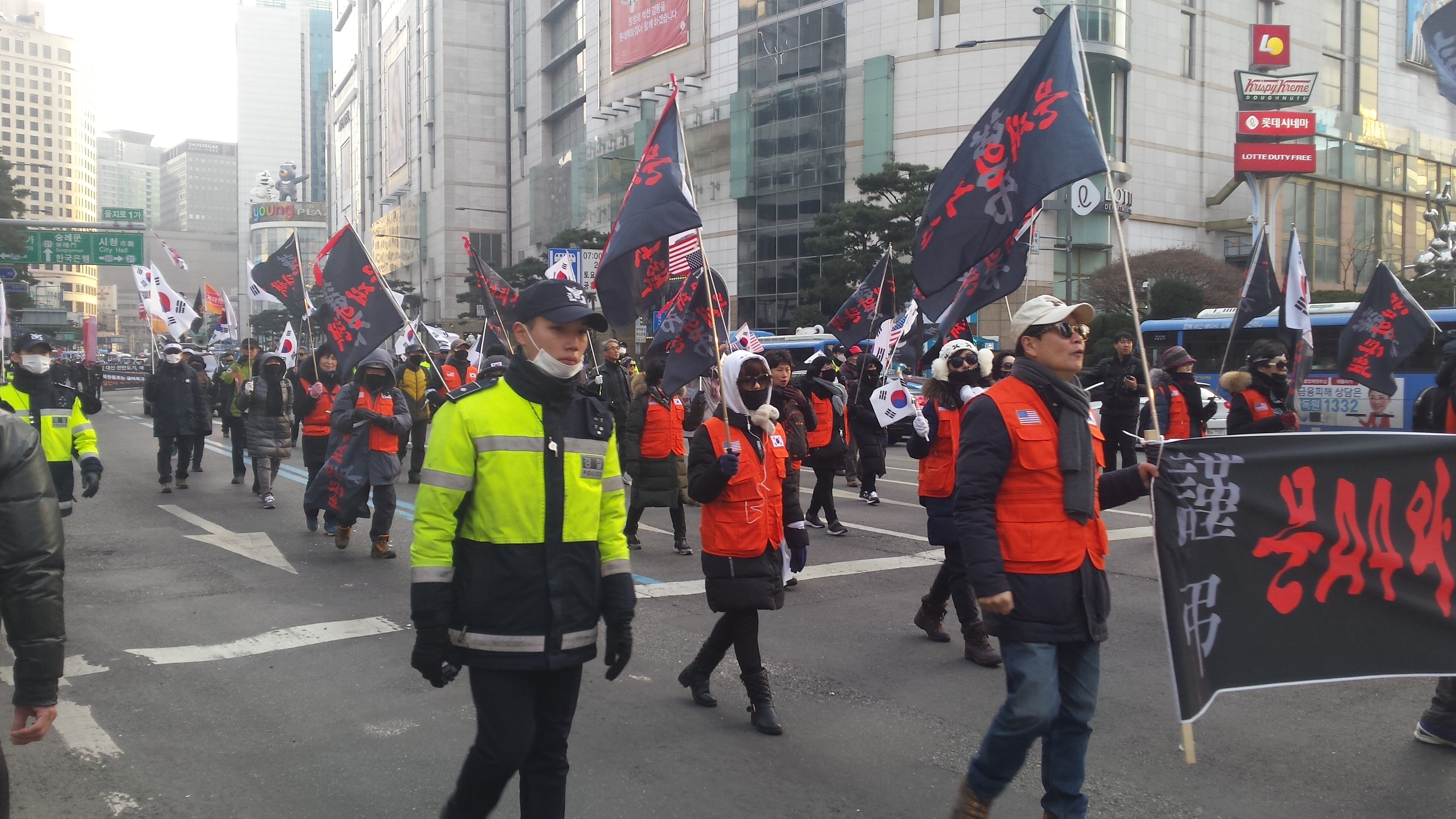 South Korean conservatives march through the streets of downtown Seoul in February in protest of their liberal president's diplomatic outreach to North Korea. Image by Rachel Oswald. South Korea, 2018. South Korean conservatives march through the streets of downtown Seoul in February in protest of their liberal president's diplomatic outreach to North Korea. Image by Rachel Oswald. South Korea, 2018.