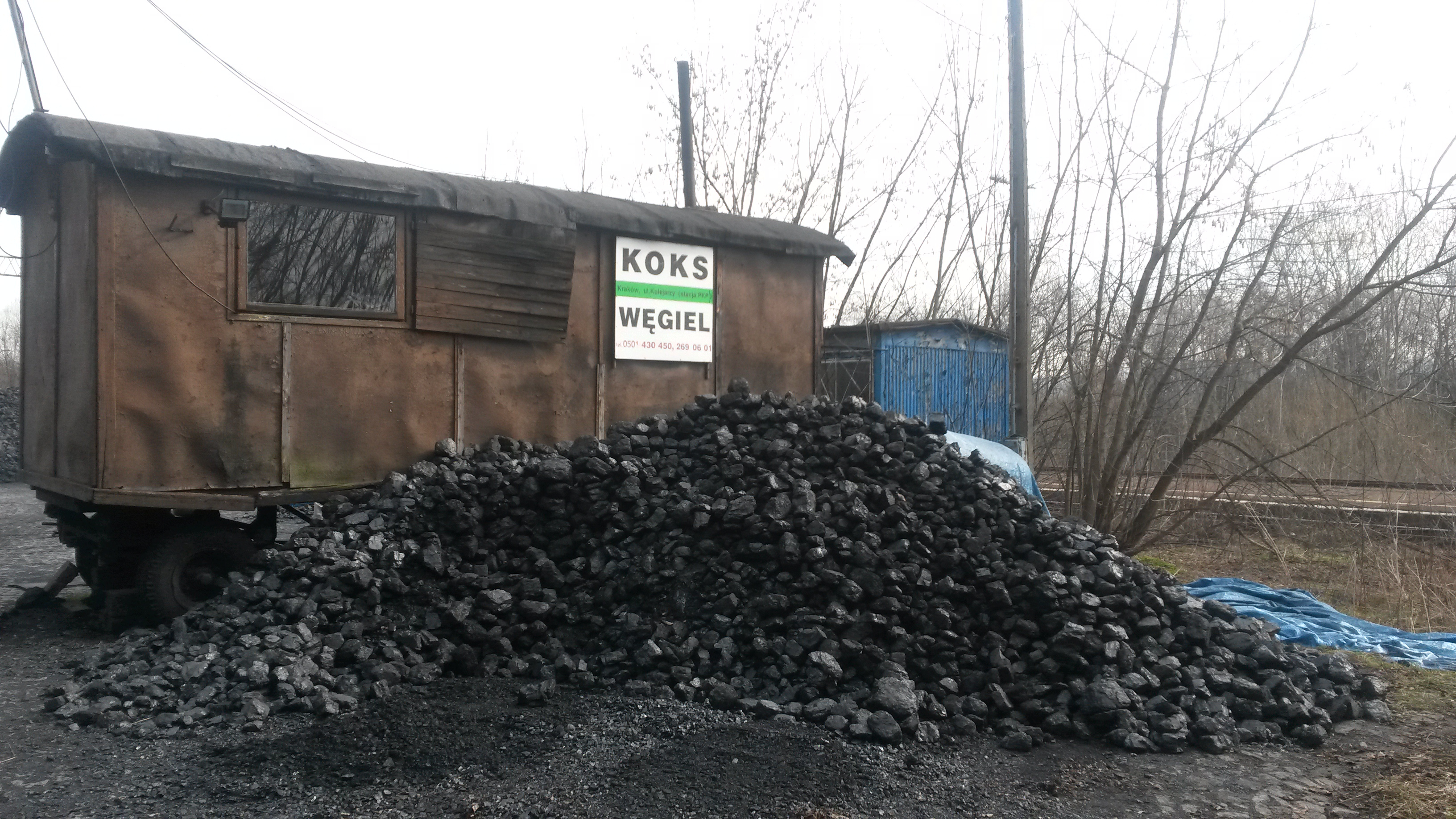 Krakow residents buy coal for home furnaces at this lot on the edge of town. Many burn it in low tech, filterless old stoves, helping to make Krakow's air the third-worst in Europe. Image by Beth Gardiner. Poland, 2015.