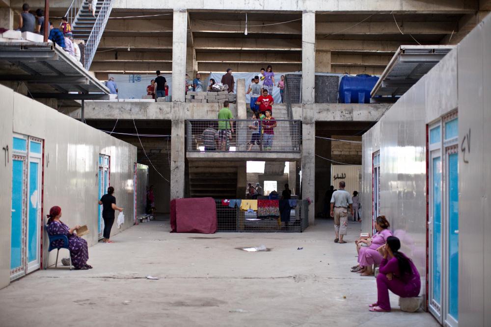 The interior of building inhabited by displaced Iraqi Christians. Photo pairs with Jenna Krajeski's Harper's Magazine article: "Marooned at the Mall". Image by Sebastian Meyer. Iraq, 2014. Media file: sebastianmeyeriraqichristian_18.jpg