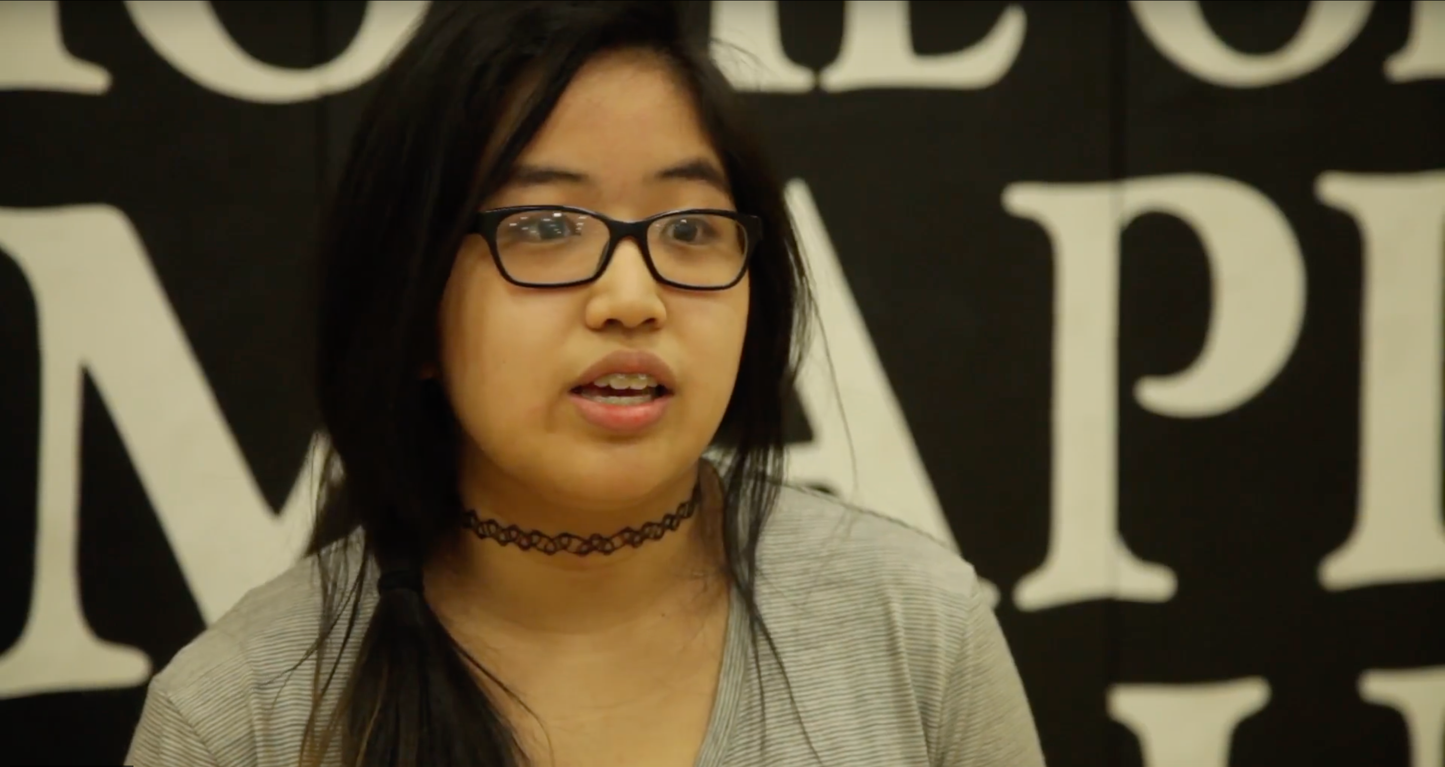 Ashely, a high school student in Winnipeg, Manitoba, shares her observations on a performance by the team from Circus Without Borders at her school. Image by Ivan Hughes. Winnipeg, 2017. Media file: cwb-video.png