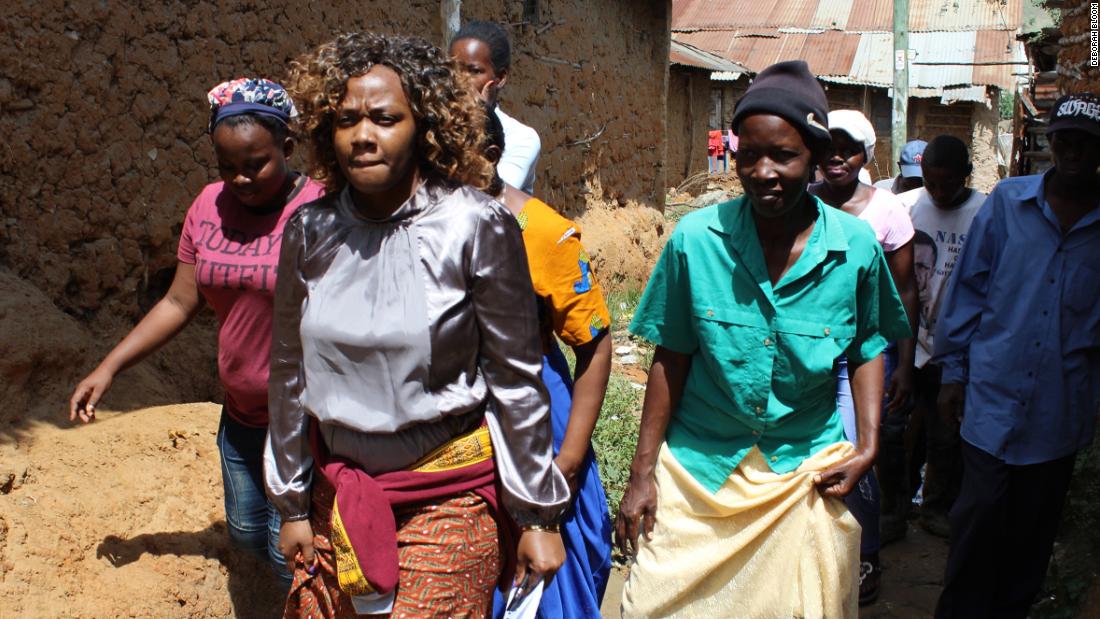Phyllis Omido walks through the village of Owino Uhuru. She has been keeping a close eye on the lead exposure that has plagued this settlement since a nearby smelter began operations in 2007. Image by Deborah Bloom. Kenya, 2018. Phyllis Omido walks through the village of Owino Uhuru. She has been keeping a close eye on the lead exposure that has plagued this settlement since a nearby smelter began operations in 2007. Image by Deborah Bloom. Kenya, 2018.