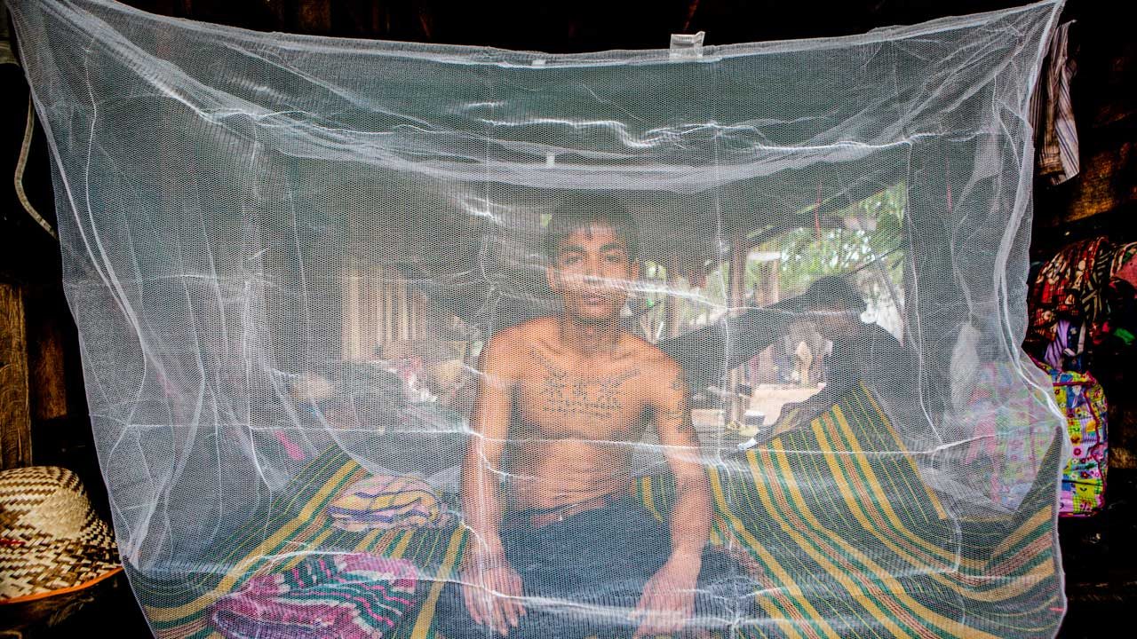 Migrant workers such as this man in Pailin, Cambodia, near the border with Thailand, are at especially high risk of contracting malaria. Image by Jeffrey Lau. Cambodia, 2016. Media file: malaria.jpg