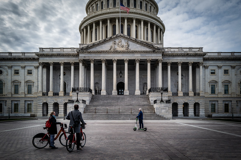On a day when nearly every museum and landmark was closed due to COVID-19, tourists use rental bikes and scooters to view the outside of the U.S. Capitol. Image by Phil Roeder / Flickr. United States, 2020. On a day when nearly every museum and landmark was closed due to COVID-19, tourists use rental bikes and scooters to view the outside of the U.S. Capitol. Image by Phil Roeder / Flickr. United States, 2020.