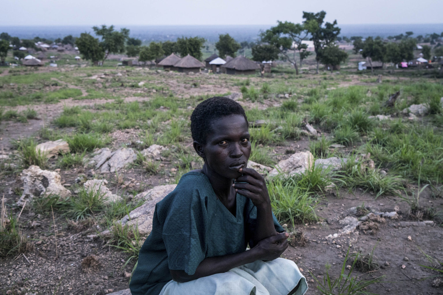 Uncertain future: Tabu Raida sits for a portrait in the Imvepi settlement for refugees that have fled from South Sudan to Uganda. Image by Adriane Ohanesian & Gael Cloarec / Getty Images. Uncertain future: Tabu Raida sits for a portrait in the Imvepi settlement for refugees that have fled from South Sudan to Uganda. Image by Adriane Ohanesian & Gael Cloarec / Getty Images.
