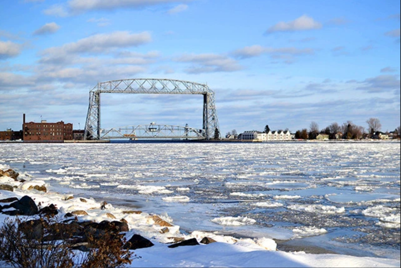 Duluth's Aerial Lift Bridge, a city landmark and passageway for ships between the city's port and Lake Superior. Image by Walker Orenstein / MinnPost. United States, undated. Duluth's Aerial Lift Bridge, a city landmark and passageway for ships between the city's port and Lake Superior. Image by Walker Orenstein / MinnPost. United States, undated.