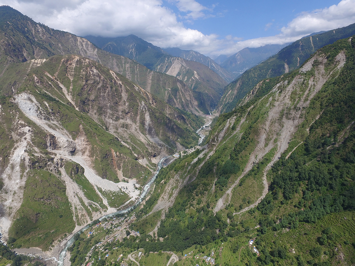 The mountainsides, severely weakened by last year’s Gorkha Earthquake, is more likely to give way, especially during monsoons and aftershocks. Image by Kristen Cook. Nepal, 2015. Landscape badly scarred by last year's quake