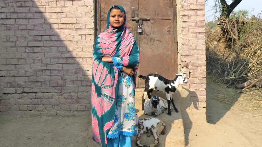Uzma Ahmed Ali stands in the courtyard of the former girls' school, which shut down several years ago. She now travels an hour to study – something few girls in her village are able to do. Image by Beenish Ahmed. Pakistan, 2014. Media file: featuredimage_0.jpg