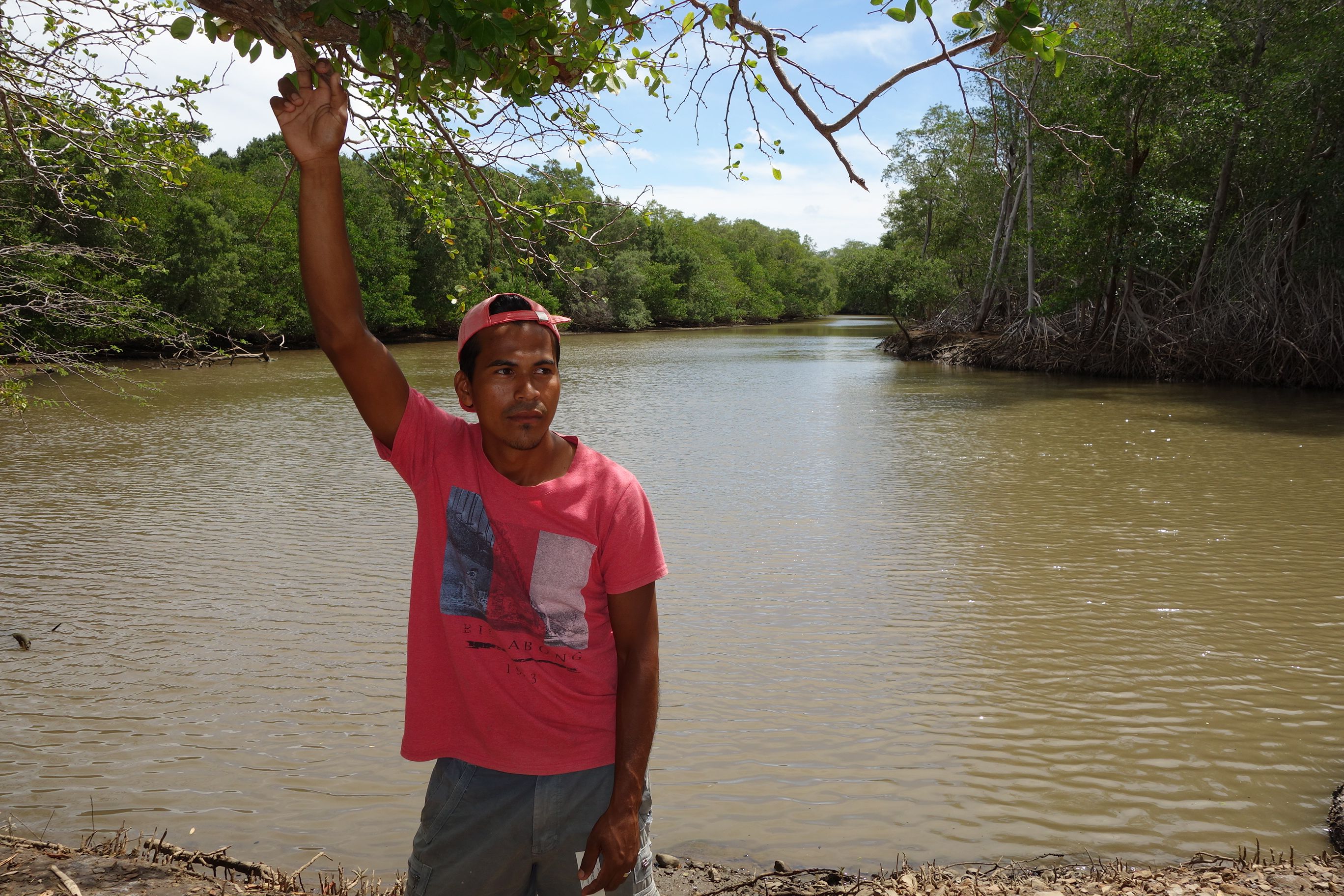 Schoolteacher Jorge Gonez is concerned that a proposed canal would ruin his favorite fishing hole on the Brito River, which lies in the project's path. Image by Chris Kraul. Nicaragua, 2015. Media file: nicacanallagoon.jpg
