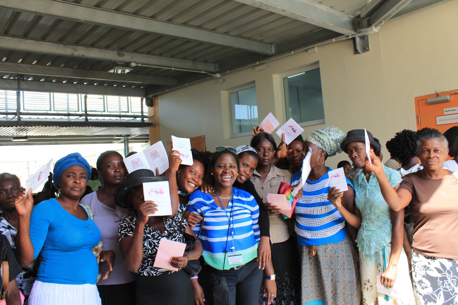 At the end of the education session, the group gathers for a picture. Most of these women will stay to get cervical cancer screenings and, if needed, cryotherapy. The other women will come back the next day to get screened. An individual screening takes about five minutes and women are moved through quickly. Both the nurses and Holdie perform the screenings on the women. Women who test positive line up against one wall and wait for the cryotherapy treatment. Cryotherapy is a painful, 11-minute long procedure. However, once women go through cryotherapy, they have an almost zero percent chance of developing cervical cancer. Image by Anna Russell. Haiti, 2017. At the end of the education session, the group gathers for a picture. Most of these women will stay to get cervical cancer screenings and, if needed, cryotherapy. The other women will come back the next day to get screened. An individual screening takes about five minutes and women are moved through quickly. Both the nurses and Holdie perform the screenings on the women. Women who test positive line up against one wall and wait for the cryotherapy treatment. Cryotherapy is a painful, 11-minute long…