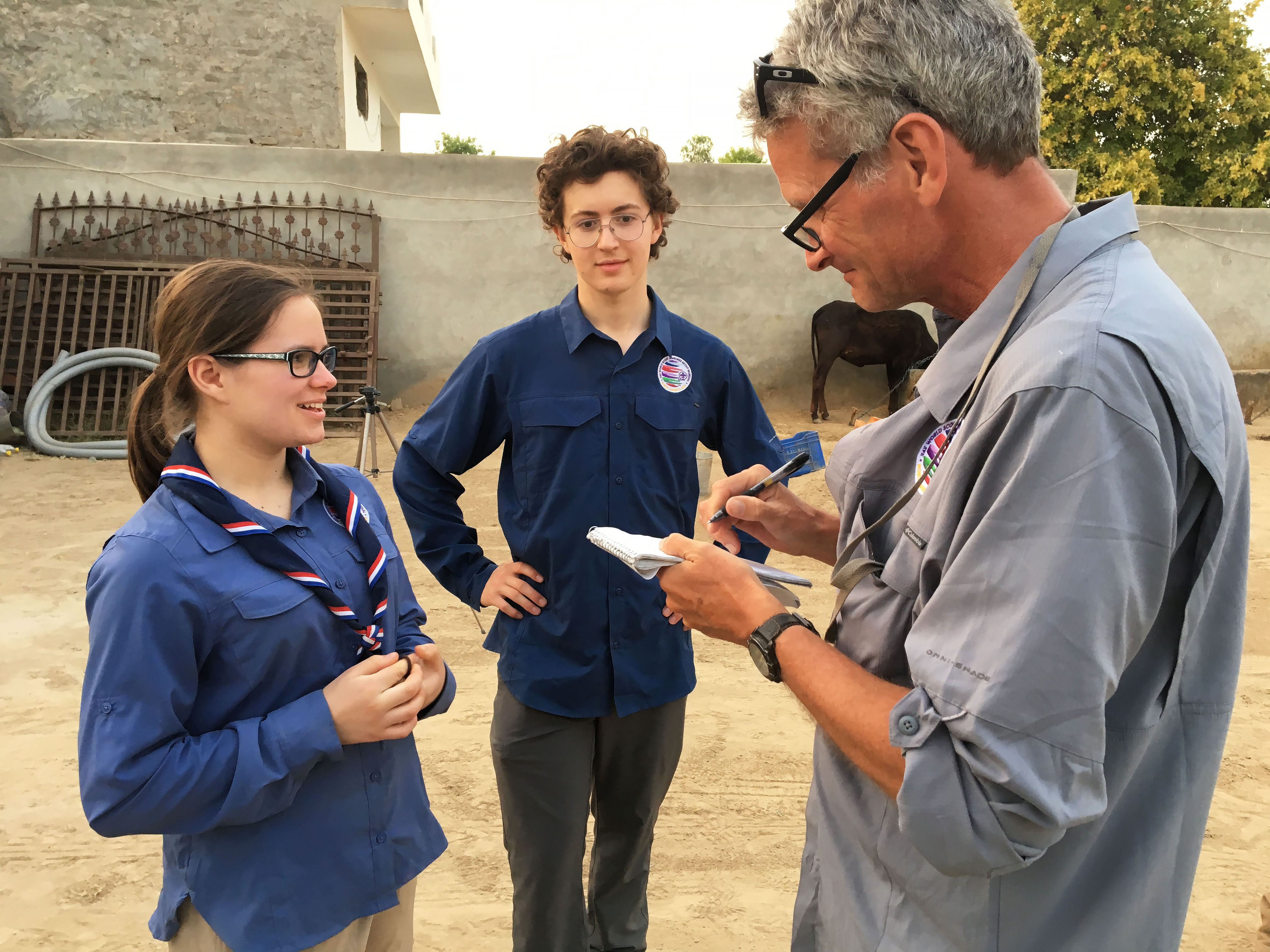 Scouts Miciah Thacker and Chris Sherman learn interviewing techniques from National Geographic Fellow Paul Salopek. Image by Mark Schulte. India, 2018. Scouts Miciah Thacker and Chris Sherman learn interviewing techniques from National Geographic Fellow Paul Salopek during a visit in northern India. Image by Mark Schulte. India, 2018.