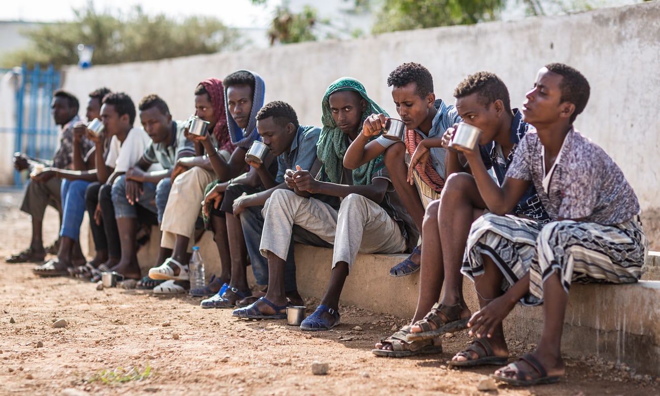 Ethiopians at the IOM transit centre in Obock, Djibouti, waiting to return home. People on the road to Obock told the Guardian that friends had perished en route. Image by Charlie Rosser. Djibouti, 2018. Ethiopians at the IOM transit centre in Obock, Djibouti, waiting to return home. People on the road to Obock told the Guardian that friends had perished en route. Image by Charlie Rosser. Djibouti, 2018.