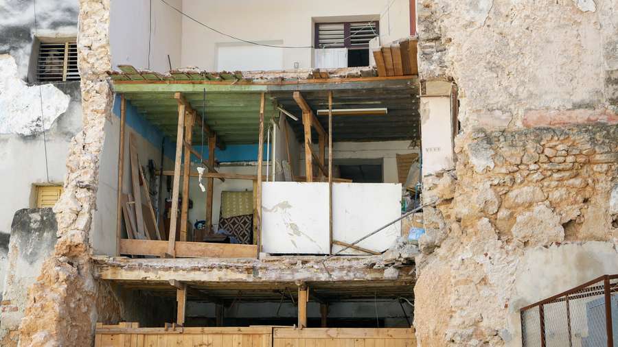 A chunk of Juan Pío Balboa's apartment crashed to the ground. His kitchen and bedroom wall had collapsed, leaving a gaping hole in the building. Image by Tracey Eaton. Cuba, 2019. A chunk of Juan Pío Balboa's apartment crashed to the ground. His kitchen and bedroom wall had collapsed, leaving a gaping hole in the building. Image by Tracey Eaton. Cuba, 2019.