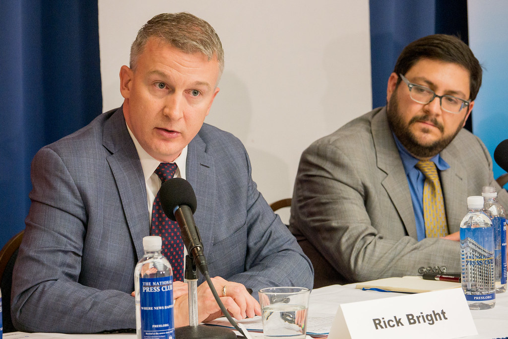 Rick Bright (left), former director of the Biomedical Advanced Research and Development Authority (BARDA), alleges in a whistleblower complaint that officials punished him for refusing to deliver funds to pharmaceutical firms run by "cronies." Image by Alliance for Health Policy / Creative Commons. United States, 2016. Rick Bright (left), former director of the Biomedical Advanced Research and Development Authority (BARDA), alleges in a whistleblower complaint that officials punished him for refusing to deliver funds to pharmaceutical firms run by "cronies." Image by Alliance for Health Policy / Creative Commons. United States, 2016.