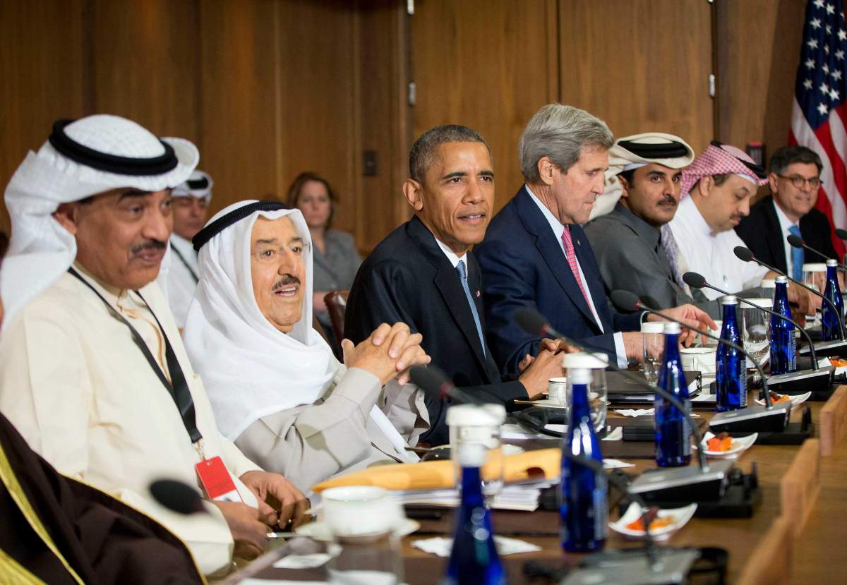 President Barack Obama sits with Kuwaiti Emir Sheikh Sabah Al-Ahmad Al-Sabah, left center, Secretary of State John Kerry, right center, and other Gulf Cooperation Council leaders and delegations at Camp David, Md., on May 14, 2015. Image by Pablo Martinez Monsivais—AP via Time Magazine. Media file: obama-camp-david.jpg