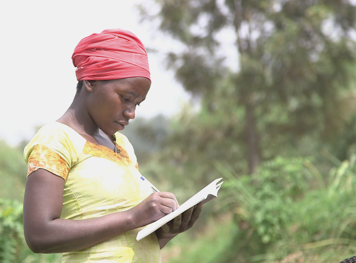 In Rwanda, women are becoming leaders in what were once male-dominated professions. Here Jacqueline Mukamunana, secretary of the Duteraninkunga cassava cooperative, takes attendance. Image by Cammie Behnke. Rwanda, 2018. In Rwanda, women are becoming leaders in what were once male-dominated professions. Here Jacqueline Mukamunana, secretary of the Duteraninkunga cassava cooperative, takes attendance. Image by Cammie Behnke. Rwanda, 2018.