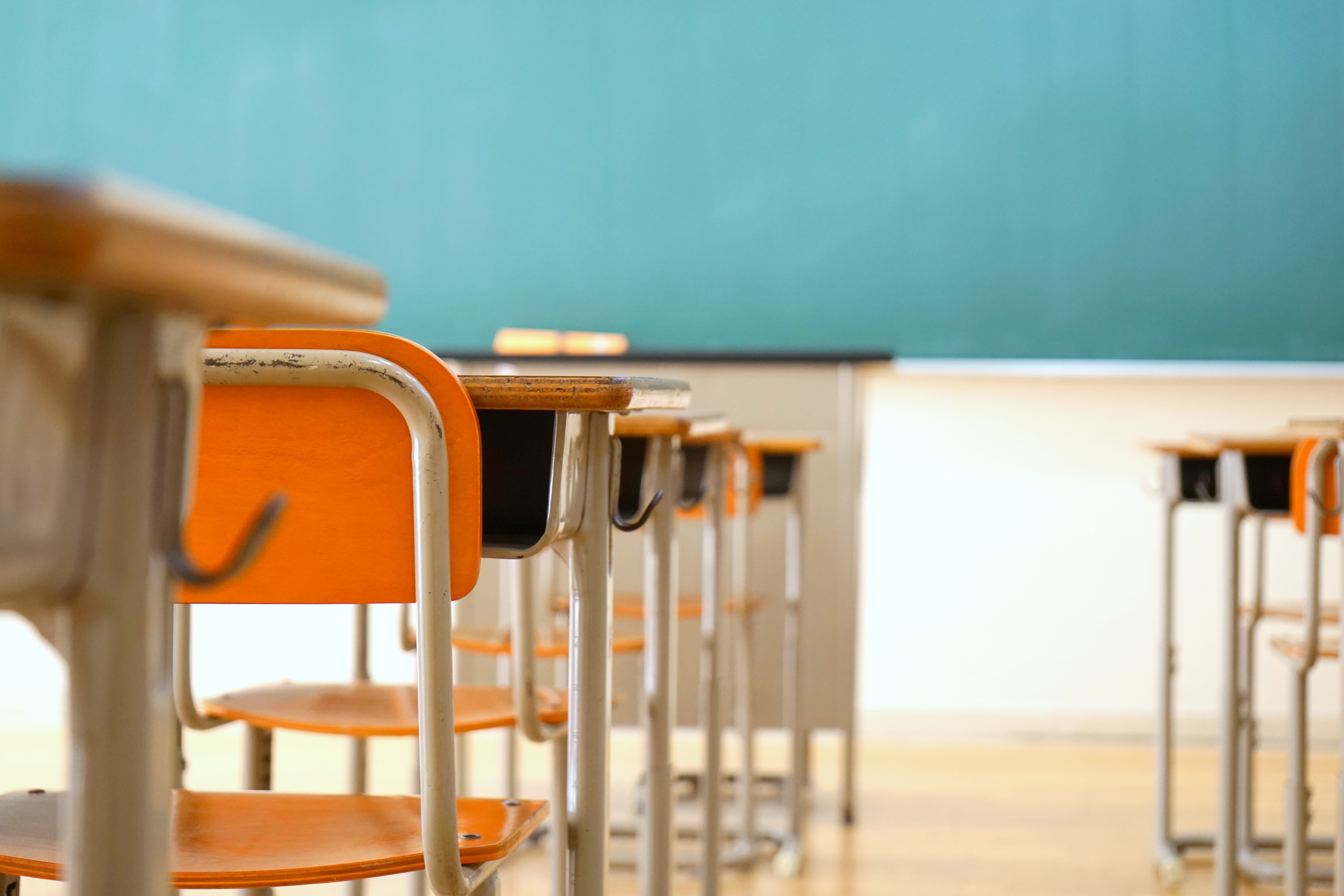 Empty desks and blackboard in a classroom. Image by maroke / Shutterstock.com. Japan, undated. Empty desks and blackboard in a classroom. Image by maroke / Shutterstock.com. Japan, undated.