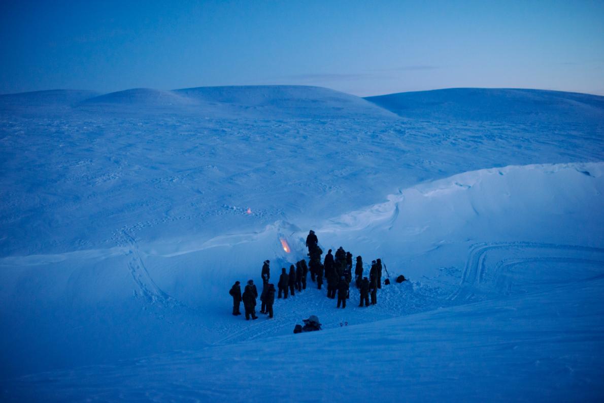 NATO soldiers and airmen learn how to carve a temporary shelter into drifted snow at the Canadian military’s Chrystal City training facility near Resolute Bay in Nunavut. Image by Louie Palu. Canada, 2018. NATO soldiers and airmen learn how to carve a temporary shelter into drifted snow at the Canadian military’s Chrystal City training facility near Resolute Bay in Nunavut. Image by Louie Palu. Canada, 2018.
