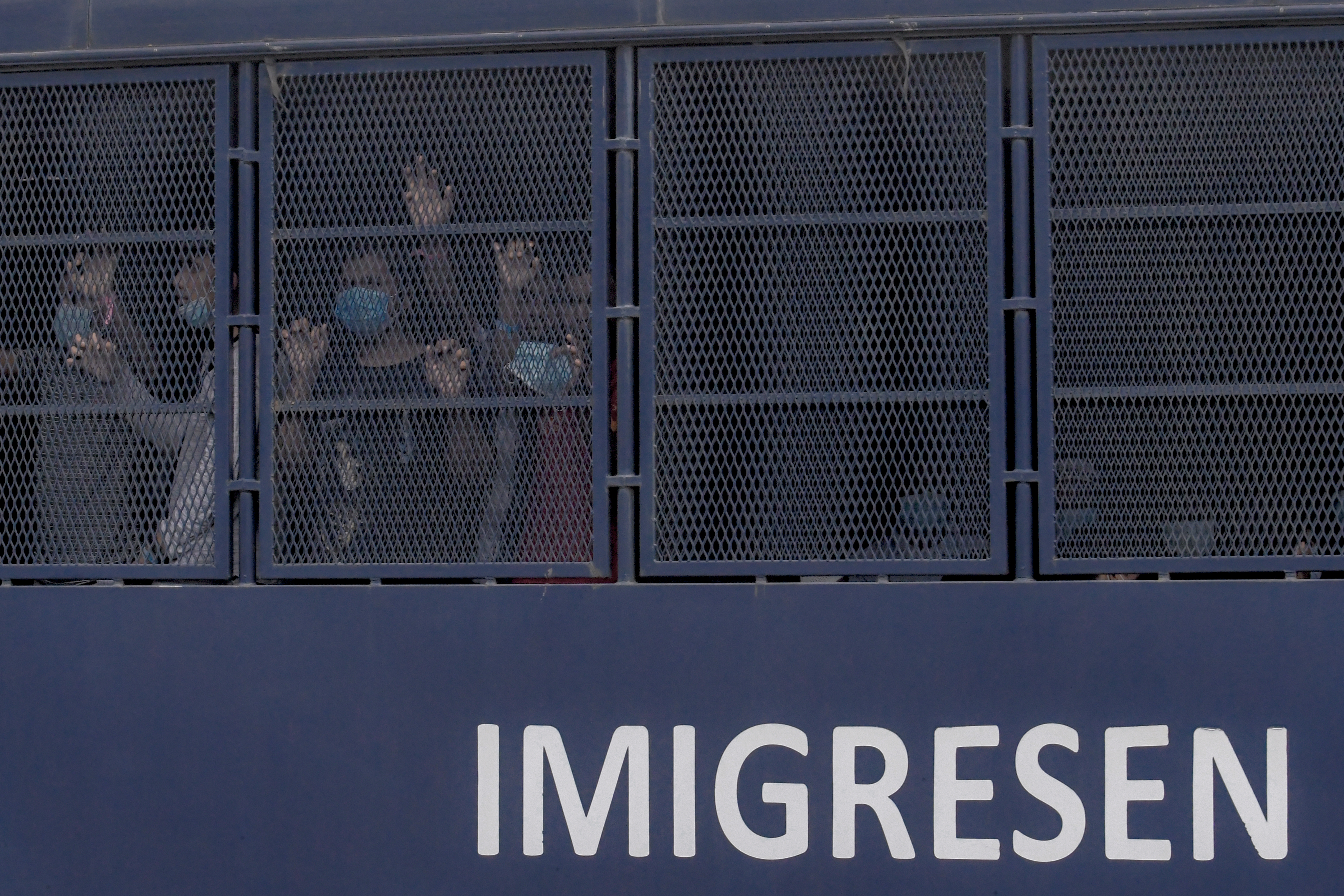 Authorities round up people during an immigration raid in Selayang, north of Kuala Lumpur, on May 11. More than 1,300 people were arrested in the raid, which followed a coronavirus lockdown. Image by Hasnoor Hussain / The New Humanitarian. Malaysia, 2020. Authorities round up people during an immigration raid in Selayang, north of Kuala Lumpur, on May 11. More than 1,300 people were arrested in the raid, which followed a coronavirus lockdown. Image by Hasnoor Hussain / The New Humanitarian. Malaysia, 2020.