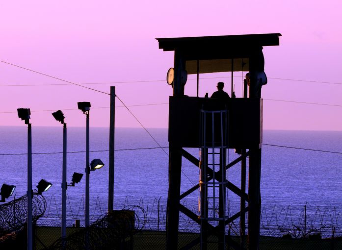 A watchtower at the Guantánamo Bay prison camp at dusk. Image by Gino Reyes. Cuba, 2011. A watchtower at the Guantánamo Bay prison camp at dusk. Image by Gino Reyes. Cuba, 2011.