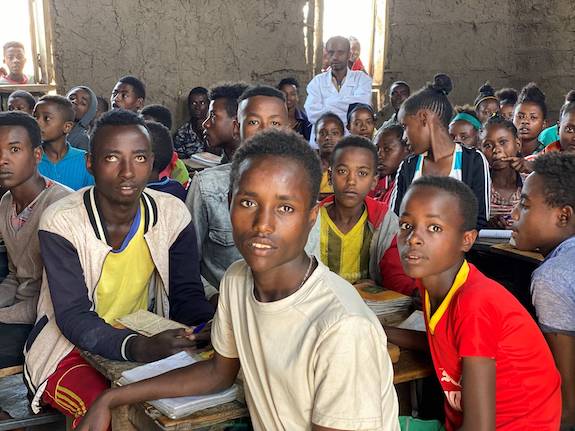 Hagirso at 21 in fourth grade classroom. Image by Anne Thurow. Ethiopia, 2019. Hagirso at 21 in fourth grade classroom. Image by Anne Thurow. Ethiopia, 2019.