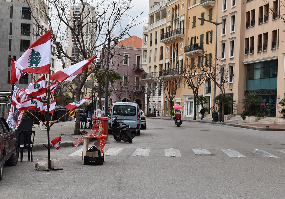 Cityscape of Martyrs' square, Beirut Downtown, Lebanon with Lebanese flag sailer for the occasion of the protest against corruption. Image by Stphanie CROCQ / Shutterstock.com. Lebanon, 2020. A street in downtown Beirut, Lebanon with Lebanese flags.