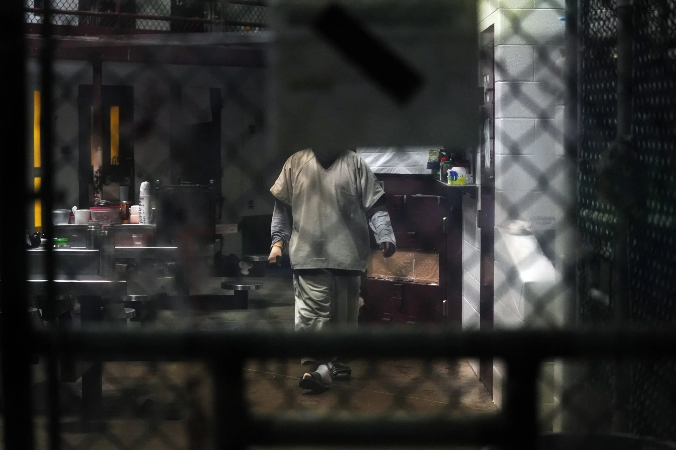A prisoner at Guantánamo Bay. Lawyers are seeking to contact their clients there while the pandemic keeps them from traveling to the base. Image by Doug Mills / The New York Times. United States, undated. A prisoner at Guantánamo Bay. Lawyers are seeking to contact their clients there while the pandemic keeps them from traveling to the base. Image by Doug Mills / The New York Times. United States, undated.