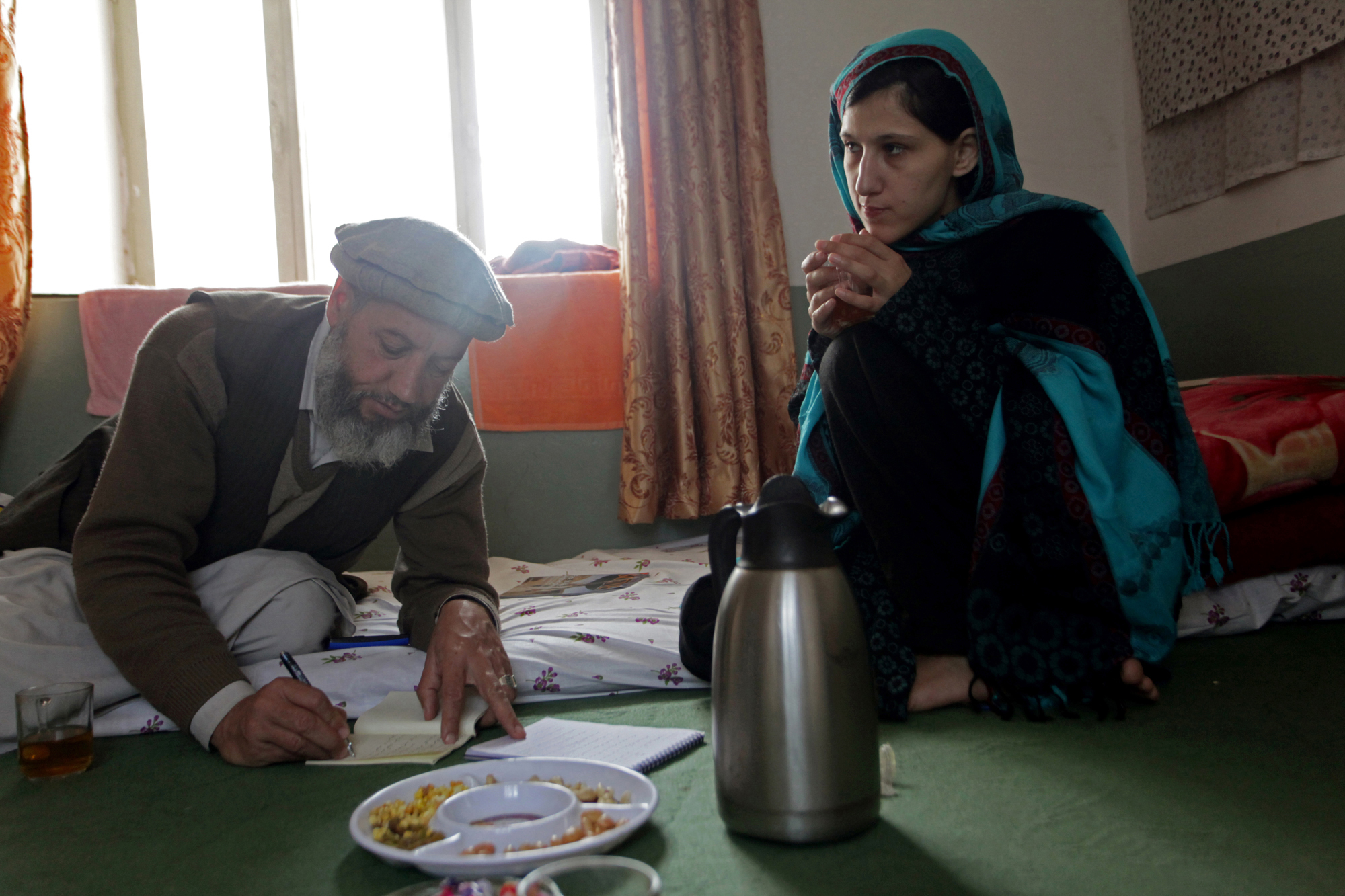 Asma, a poet and translator, proved an invaluable contributor, patiently working with young women to gently coax from them their most intimate landay. She spent many hours translating these from Pashto to English. Image by Seamus Murphy. Afghanistan, 2013. Media file: asma.jpg