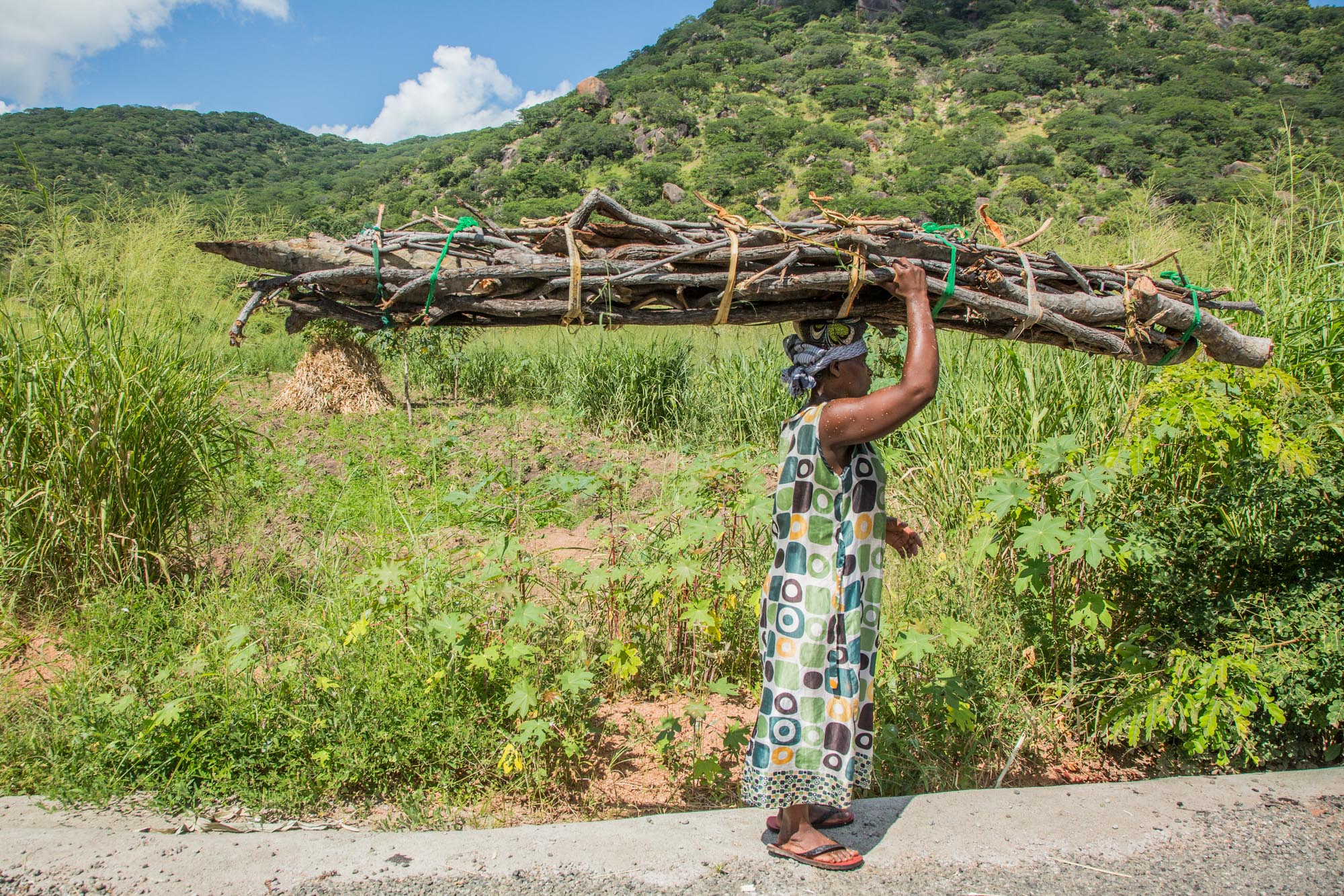 Women in Malawi spend up to 6 hours a day collecting firewood for cooking and heating. Image by Nathalie Bertrams. Malawi, 2017. Women in Malawi spend up to 6 hours a day collecting firewood for cooking and heating. Image by Nathalie Bertrams. Malawi, 2017.