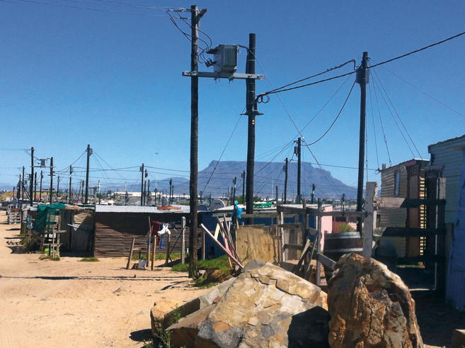 Face masks create a stigma in townships such as this one outside Cape Town. Image by Meera Senthilingam. South Africa, 2014.