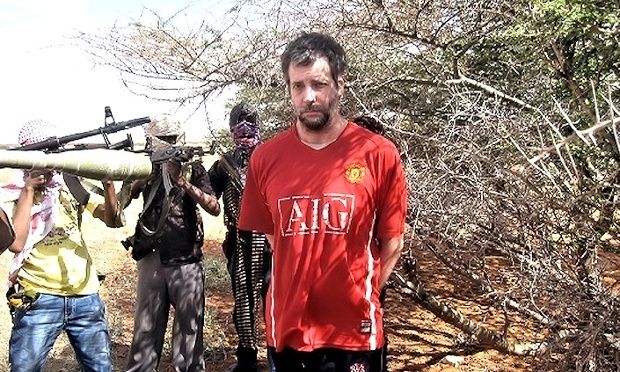 Michael Scott Moore surrounded by his Somali captors, who demanded a $20m ransom. Image taken from hostage video made by kidnappers. Media file: msm.jpg