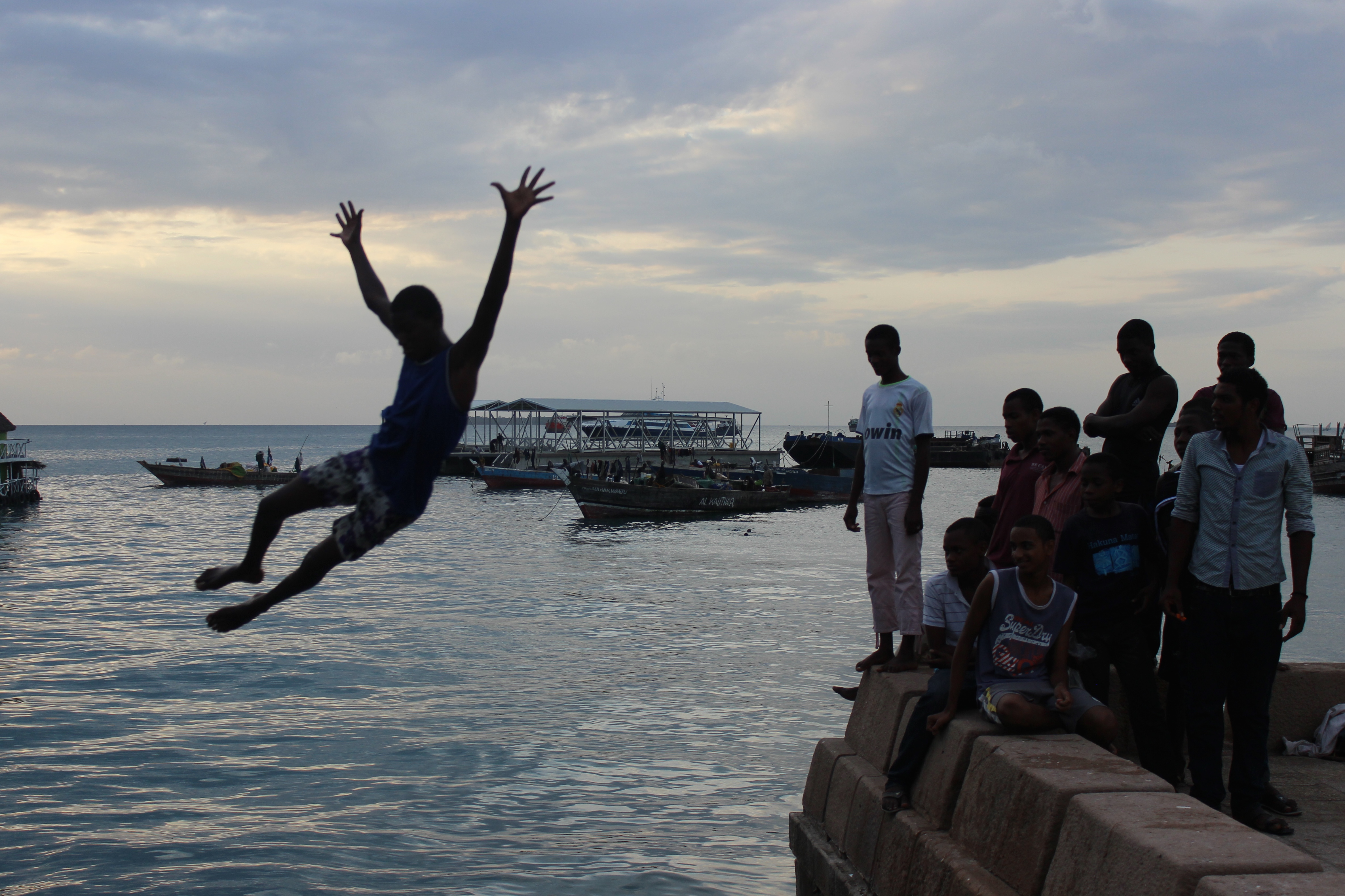 Jumping off the cement perimeter into the ocean at Forodhani Gardens is a nightly event for young boys in Stone Town, Zanzibar. Image by Claire Elizabeth Felter. Tanzania, 2015.