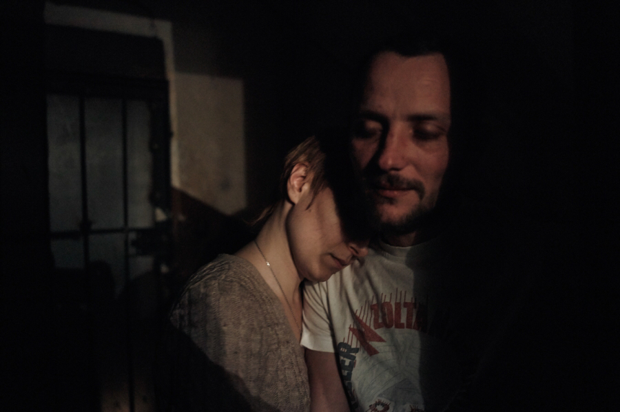 Sveta is reunited with her husband Aleksei after he spent months as POW of a separatist group. He hid his HIV status from his captors while Sveta managed to sneak his meds to him. Image by Misha Friedman. Ukraine, 2014.
