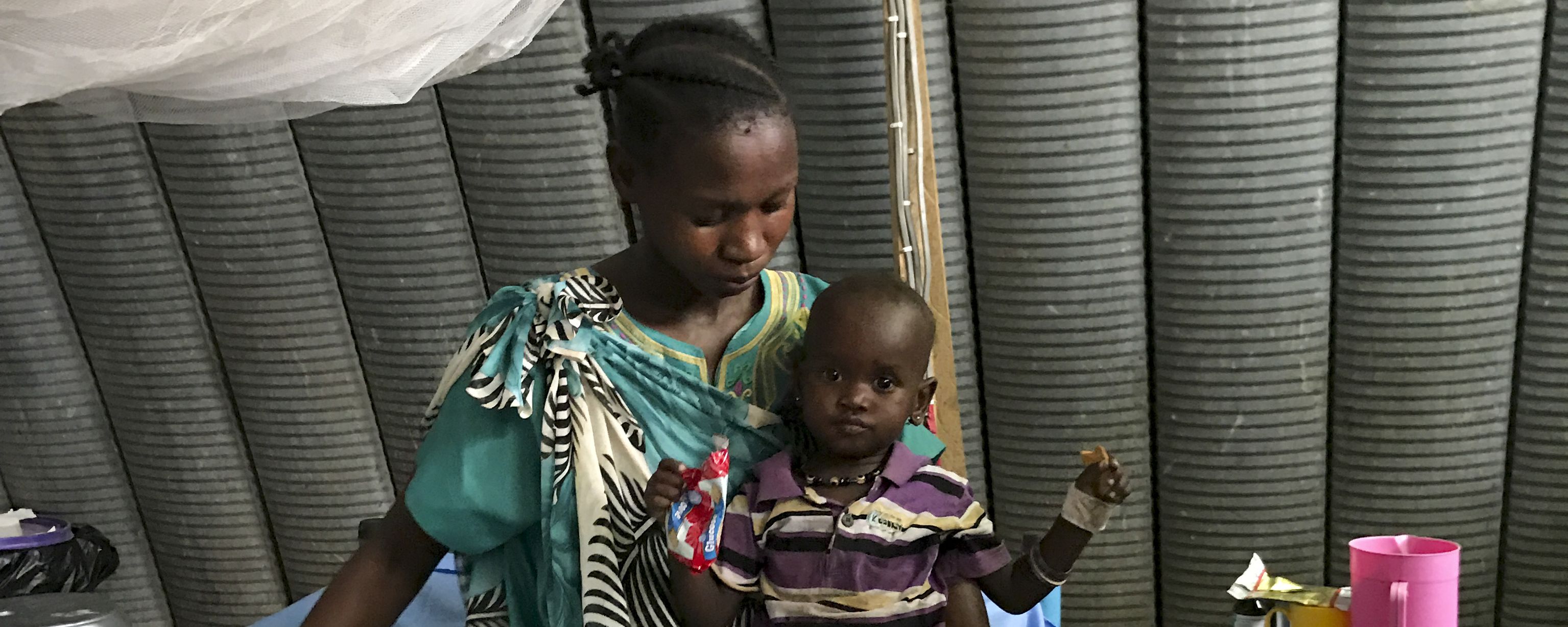 A woman with her child in the International Medical Corps hospital in Juba, South Sudan. Image by Jane Ferguson. South Sudan, 2017. A woman with her child in the International Medical Corps hospital in Juba, South Sudan. Image by Jane Ferguson. South Sudan, 2017.
