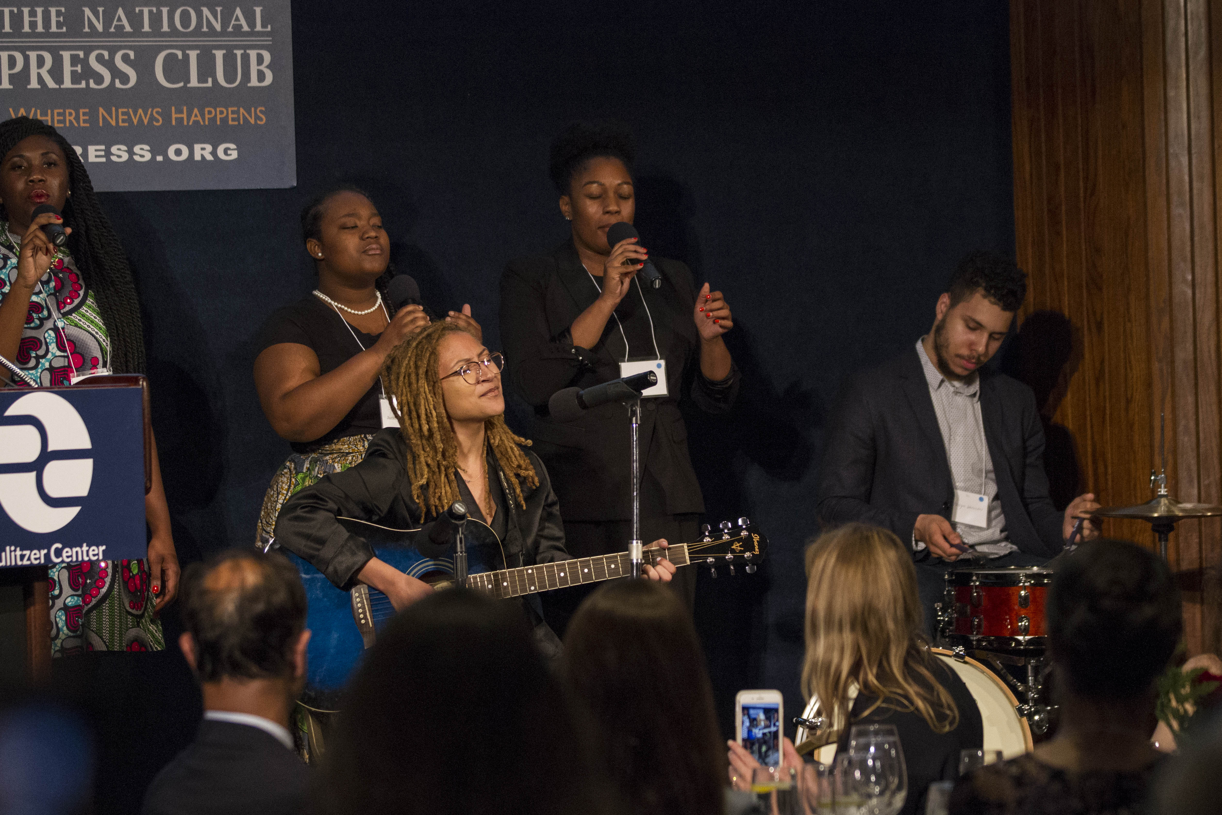 Indigo Passariello and her bandmates Ekep Nkwelle, Issayah Whitesides, Jillian Willis, and Jasmine Thomas. Passariello performed "Hands Up Don't Shoot." Image by Jin Ding. Washington, D.C., 2018. Indigo Passariello and her bandmates Ekep Nkwelle, Issayah Whitesides, Jillian Willis, and Jasmine Thomas. Passariello performed "Hands Up Don't Shoot." Image by Jin Ding. Washington, D.C., 2018.