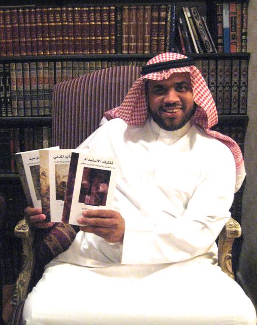 Mohammed Abdul Kareem with his three books, the last one banned in Saudi. Image by Caryle Murphy. Saudi Arabia, 2014. Media file: mohammed_abdulkareem_1.jpg