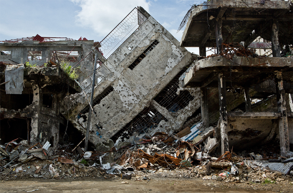 ISIS fighters have left damage in their wake while trying to take hold of cities in the Philippines. Image by David Maurice Smith. Philippines, 2018. ISIS fighters have left damage in their wake while trying to take hold of cities in the Philippines. Image by David Maurice Smith. Philippines, 2018.