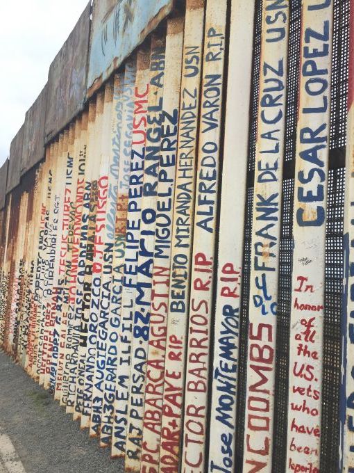 The names of deported veterans were painted in the wall that separates Tijuana, Mexico and San Diego. United States, 2019. Image by Maria Ines Zamudio. The names of deported veterans were painted in the wall that separates Tijuana, Mexico and San Diego. Image by Maria Ines Zamudio. United States, 2019.
