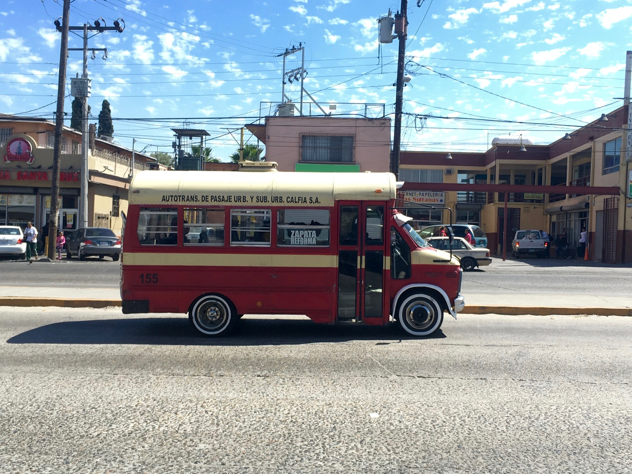 This minibus, probably a secondhand American school bus, is owned by transportation firm Calfia. Note that vehicles like these, regardless of owner, are locally known as "calafias." Image by Patrick Reilly. Mexico, 2017. This minibus, probably a secondhand American school bus, is owned by transportation firm Calfia. Note that vehicles like these, regardless of owner, are locally known as "calafias." Image by Patrick Reilly. Mexico, 2017.