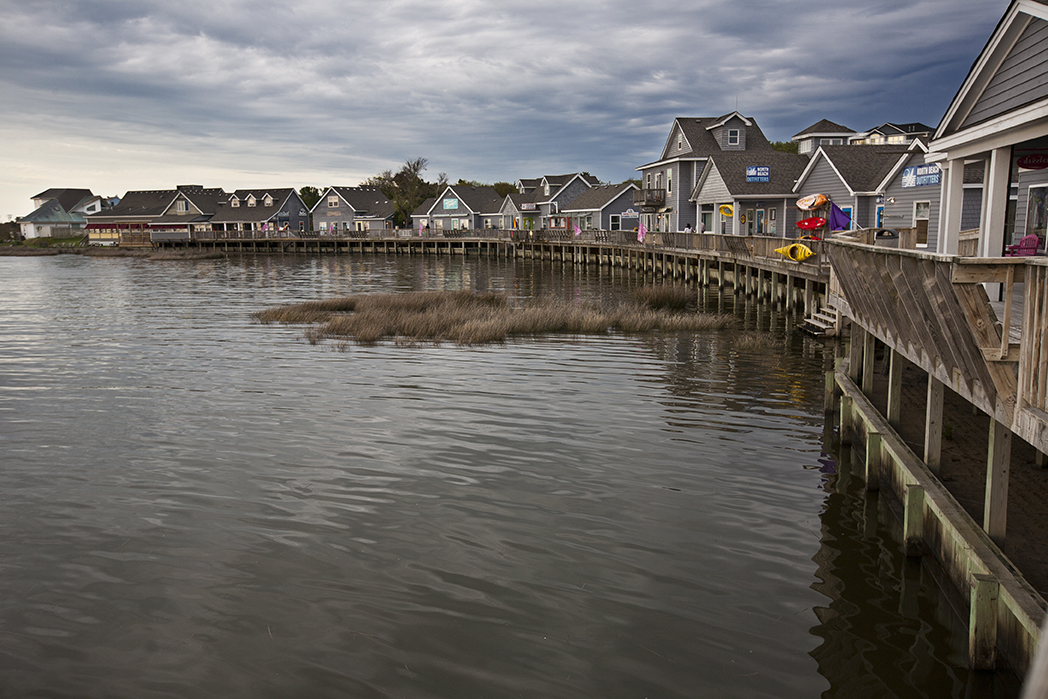 A waterfront pier in Duck, North Carolina. Image by aceshot1 / Shutterstock.com. United States, 2014. A waterfront pier in Duck, North Carolina. Image by aceshot1 / Shutterstock.com. United States, 2014.